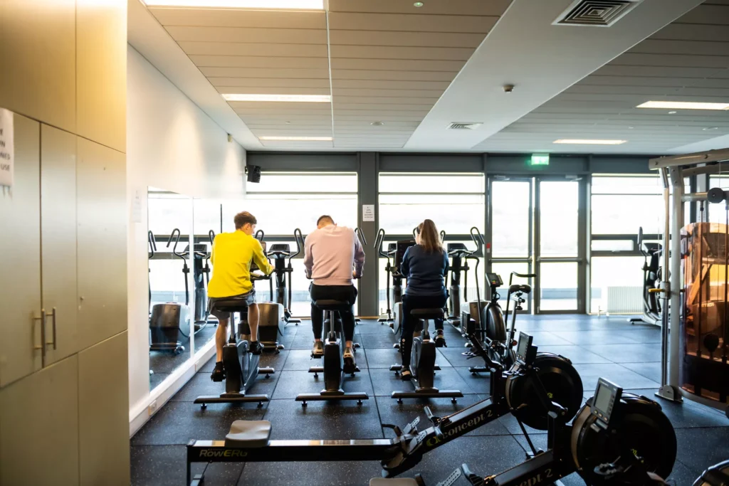 Students on exercise bikes in the gym of Knocknarea Arena on the Sligo campus