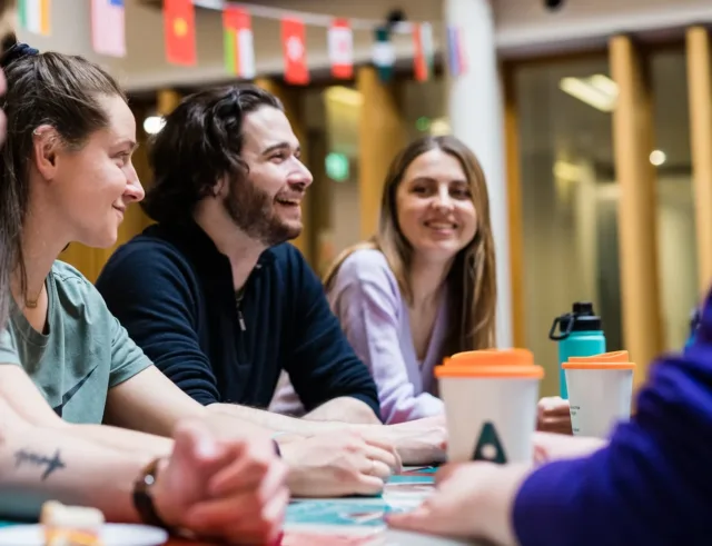 A group of students chatting in the canteen