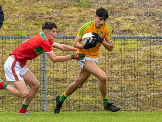 2 men playing football