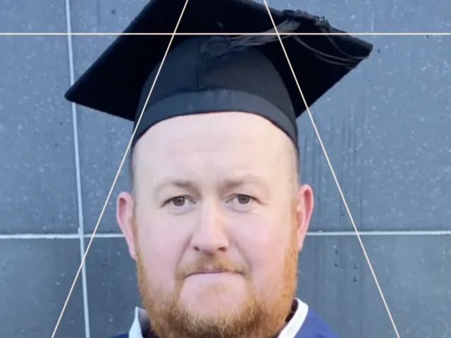 Male graduate in graduation cap