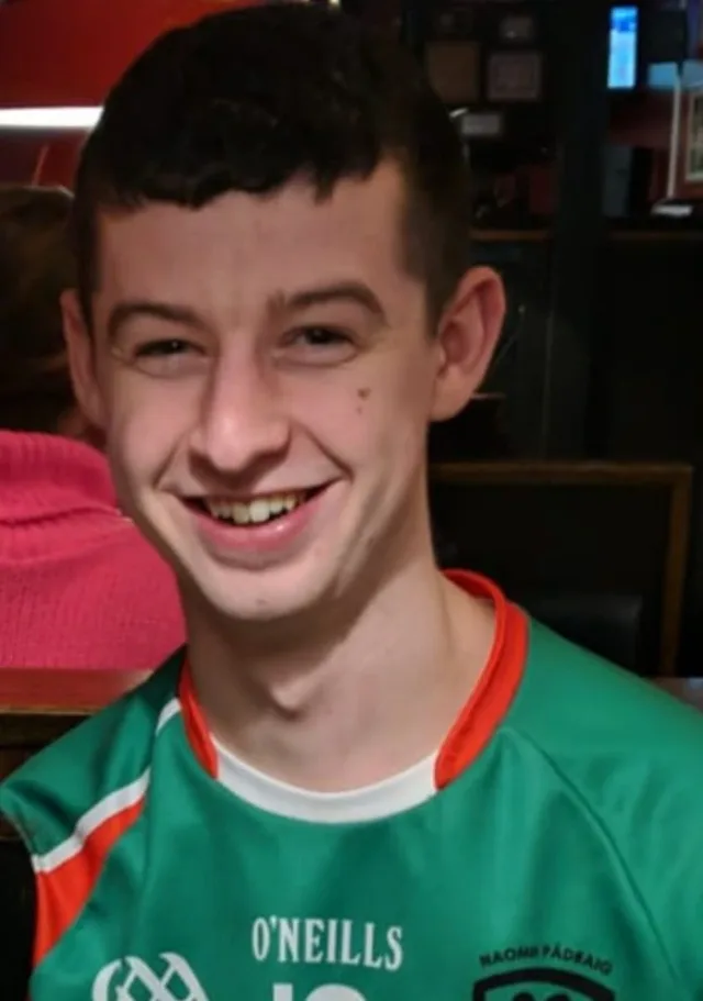 ATU male student in green and red jersey