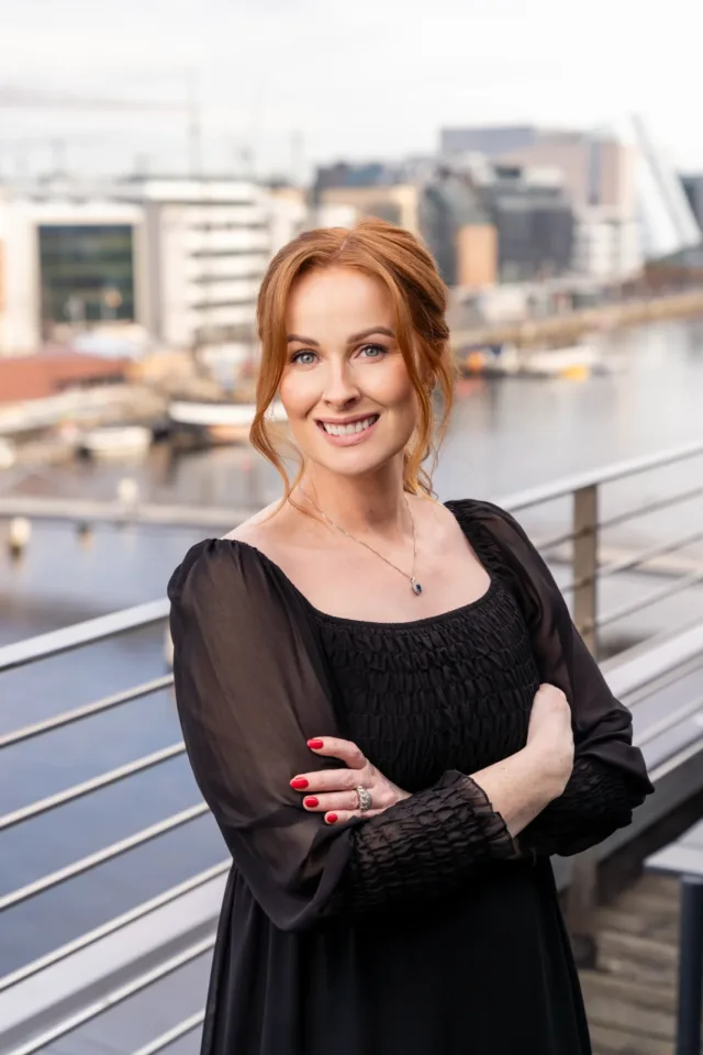 Woman with red hair and black dress