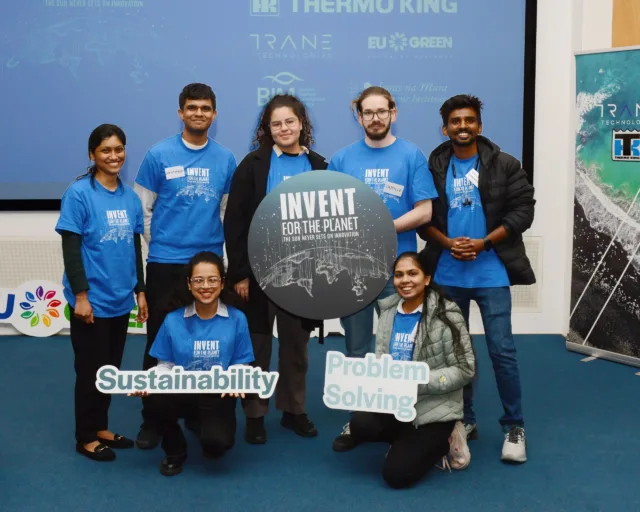 The winning ATU team for Invent for the Planet pictured holding an invent for the planet sign and signs that read sustainability and problem solving.