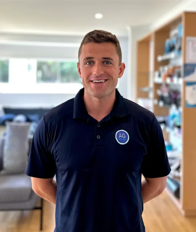 Man in navy top with black hair