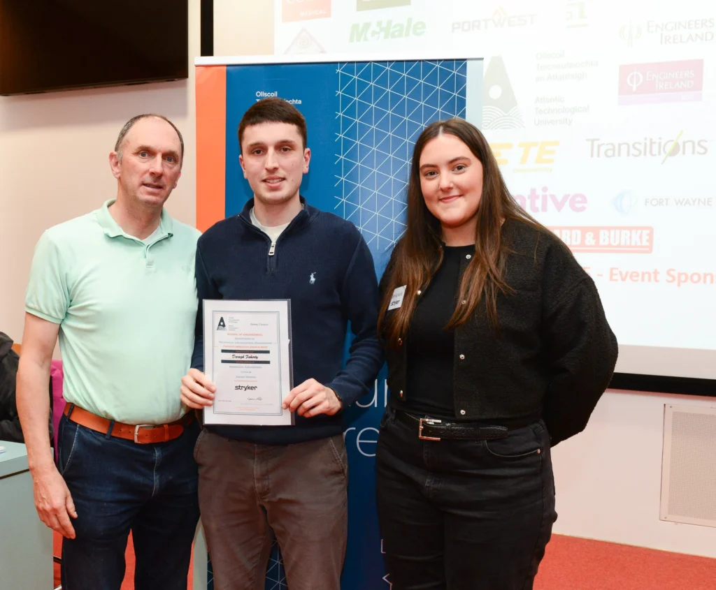 ATU representative, student, and award representative presenting a certificate to the student