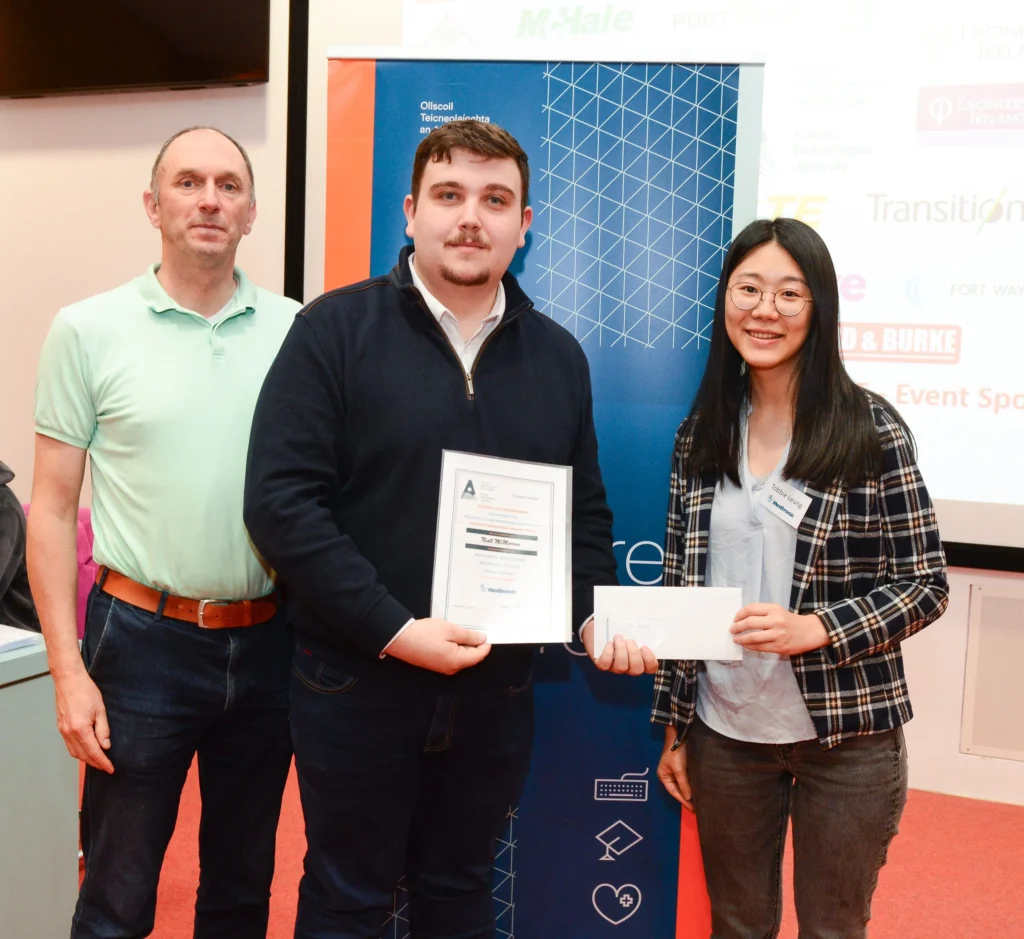 ATU representative, student, and award representative presenting a certificate to the student