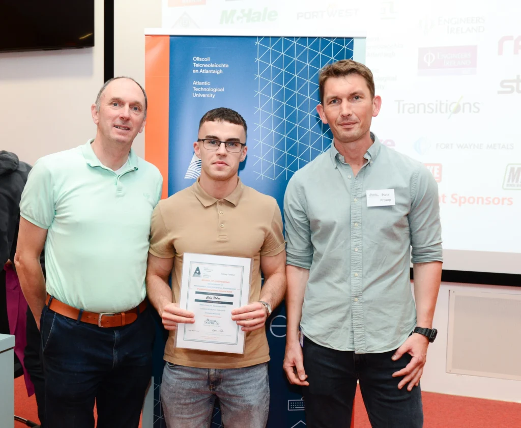 ATU representative, student, and award representative presenting a certificate to the student