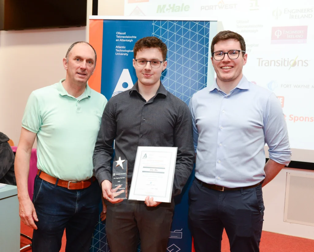 ATU representative, student, and award representative presenting a certificate to the student
