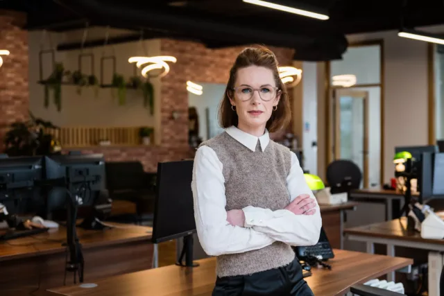 Female business student standing in an office