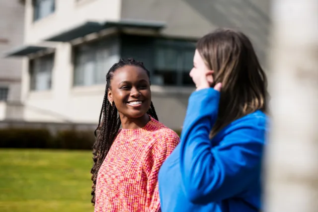 image of two students walking through campus