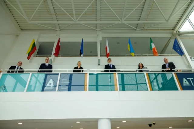 Ambassadors from Ukraine, Poland, Lithuania, Latvia and Estonia pictured beneath their respective country's flags at ATU