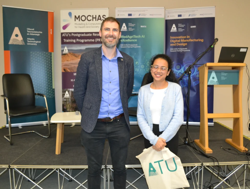 Dipshikha Das presented with prize by supervisor, Dr Philip Long.