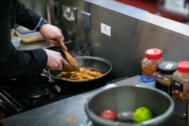 Generic photo of chicken being cooked on a pan