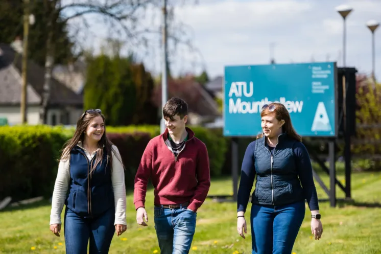 Students walking and smiling at the ATU campus at Mountbellew.
