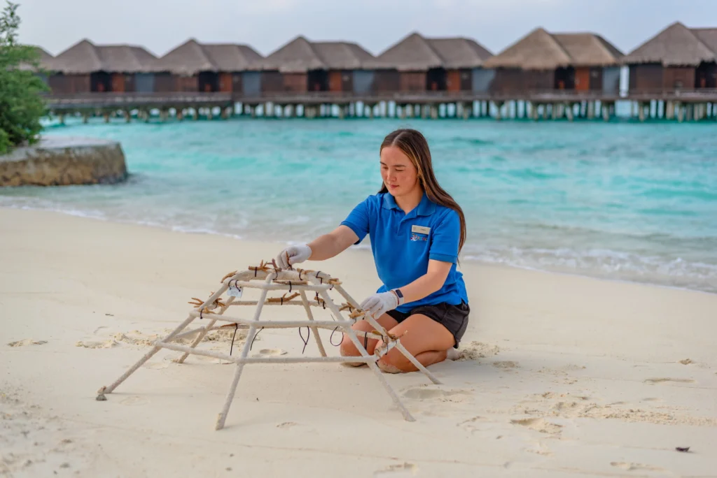 Katelyn Hegarty next to coral reef garden