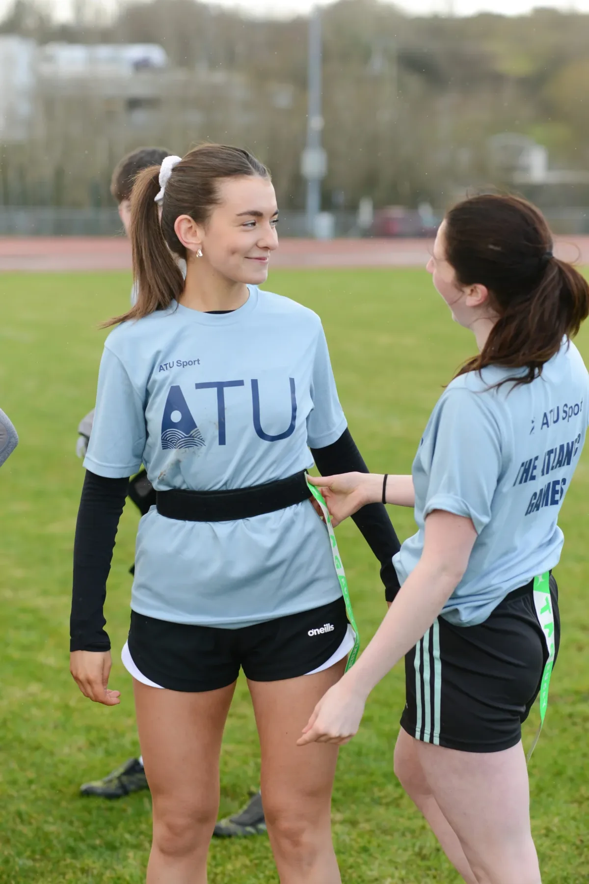 Girls chatting in football gear