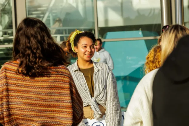 female student smiling in a group