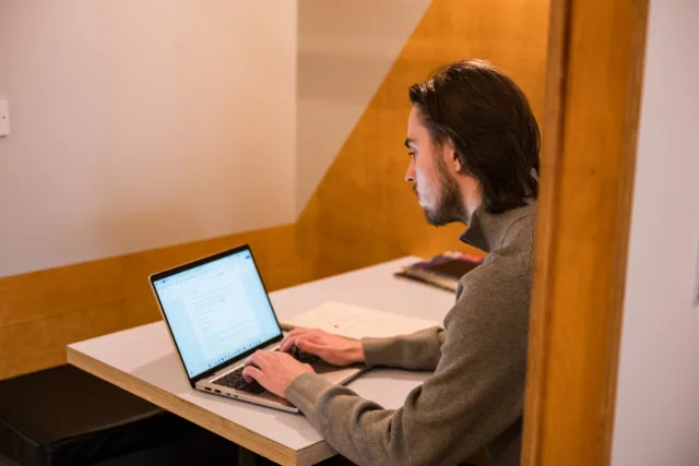 Male student studying online