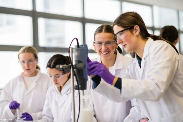 Students with lab equipment