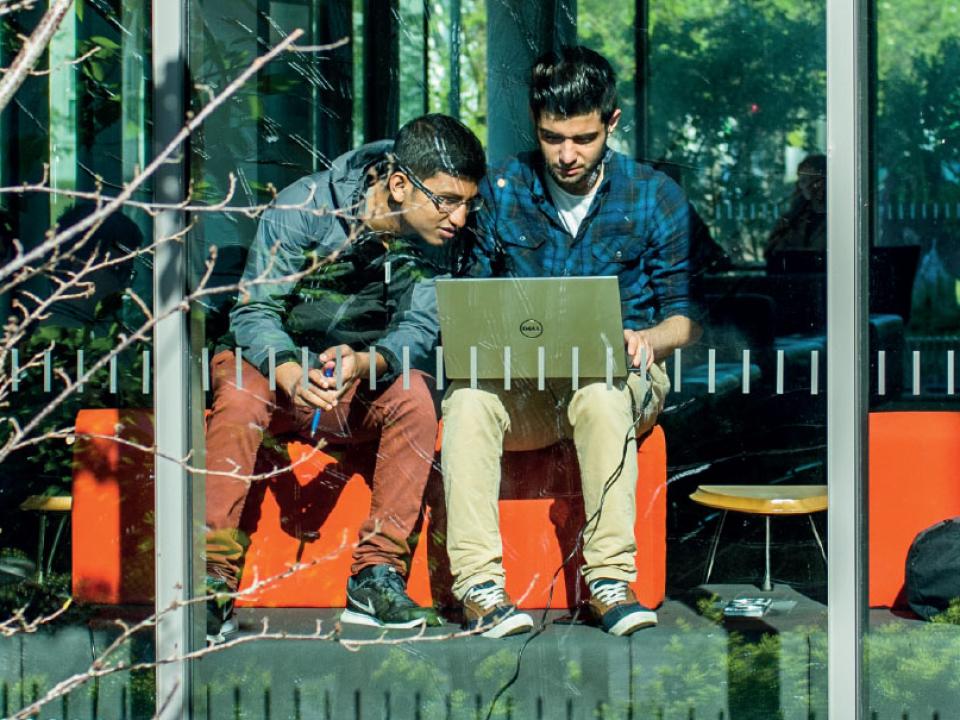 Two international students sitting in window of ATU Sligo library