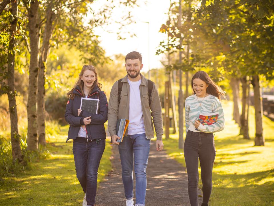 image of 3 students walking in campus