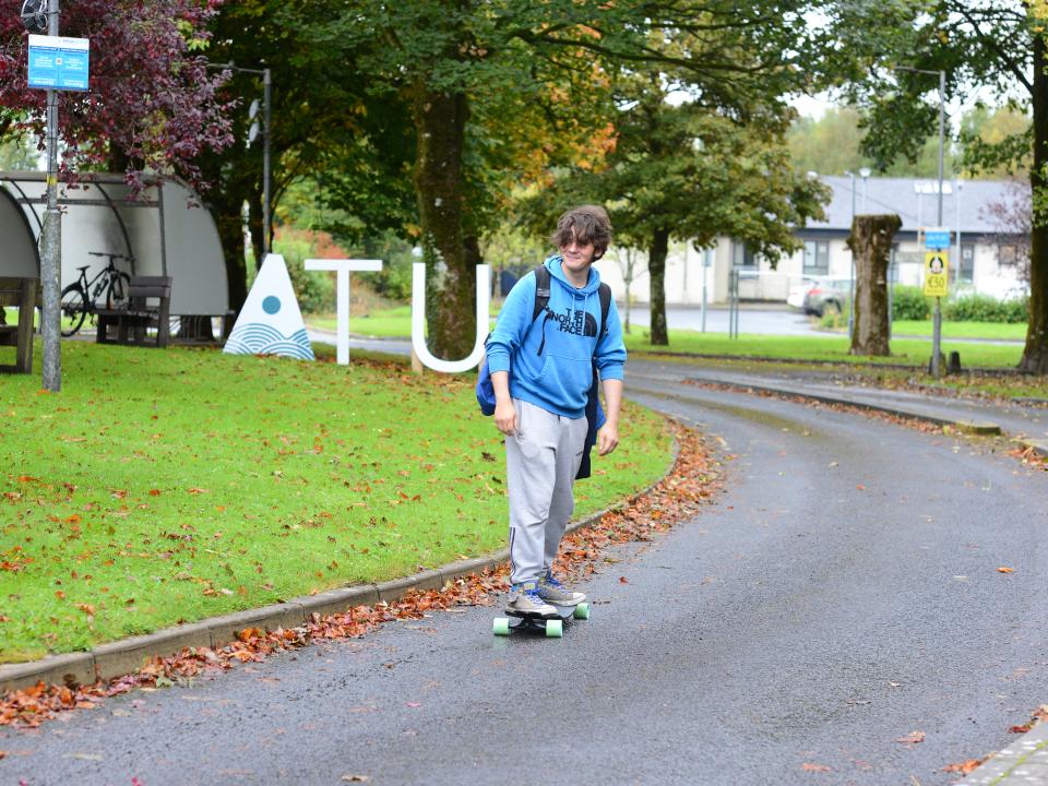 Student on skateboard at ATU Mayo campus